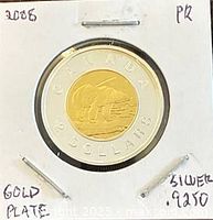 Reverse side showing polar bear, CANADA, 2 DOLLARS lettering, .925 silver ring and gold-plated center