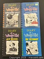 Front covers of all four books arranged together