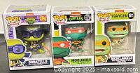 front view of three boxed Funko Pop TMNT figures