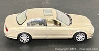Left side profile of beige 1:18 Jaguar S-Type model