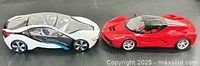 Side view of BMW i8 and Ferrari LaFerrari Aperta RC cars