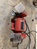 Top view of Ashland red bench grinder showing both grinding wheels, tool rests and eye shields