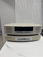 Front view of Bose Wave Music System III stacked atop CD changer