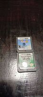 Front view of both Nintendo DS cartridges showing labels for Catz 2 and Personal Trainer: Math