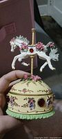 Full view of porcelain music & keepsake box with carousel horse lid