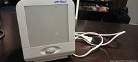 Front view of Verilux HappyLight lamp showing screen, power button and cord
