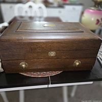 Closed oak chest with brass hardware