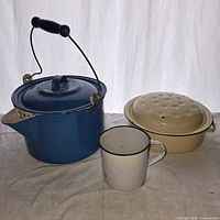 All four enamelware pieces grouped together