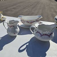 Group shot of milk jug, creamer, gravy boat and underplate