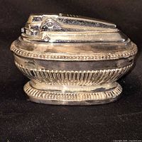 Silver-tone Ronson table lighter showing overall design and condition