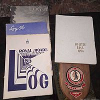 Stack of yearbooks and plaque visible