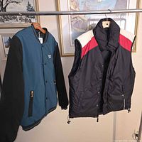 Both outerwear items on hangers for full view