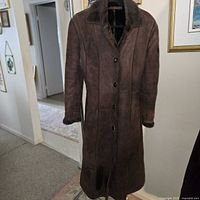 Front view of brown suede shearling coat
