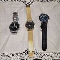 Front view of all three wristwatches side by side