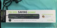 Boxed Embertec Emberstrip 8AV+ power-saving power strip showing product details and cable