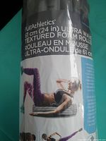 Front view of PurAthletics Ultra Wave 61 cm textured foam roller in original wrap
