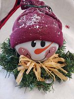 Front view of snowman globe light unlit