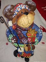 Full view of painted resin snow bear figurine with cub