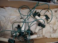 Loose green-wire candle lights in box