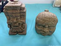 Front view of both ceramic decanters, showing shapes