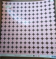Front view of sealed package showing pink dot pattern and 25 count label