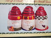 Retail box showing the three ceramic Santa snack jars