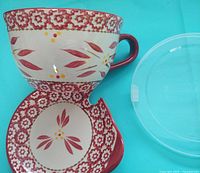 Mug and saucer showing red Old World pattern
