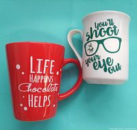 Front view red and white mugs showing graphics