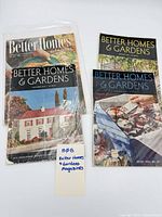 Four Better Homes and Gardens magazines in sleeves, grouped