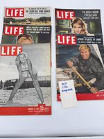 All five Life magazines laid out, covers visible