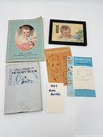 Group shot of five vintage baby care items laid out