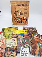 Group shot of seven barbecue cookbooks including one on stand