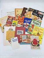 Group view of all cookbooks and recipe sheets spread out