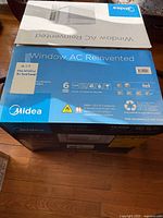 Top view of sealed Midea U-Shaped window AC box