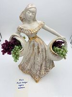 Front view of Royal Haeger Gypsy Woman figurine with grape baskets