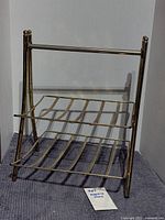 Full view of brass-tone metal magazine rack