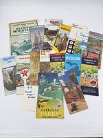 All fifteen vintage road maps and guides spread out