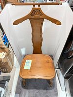 Full view of wooden valet chair showing hanger back and seat