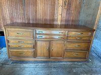 Front view showing all drawers and cabinet doors