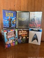 Front view of all six video sets showing titles and formats