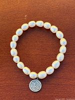 Full view of pearl strand formed as circle