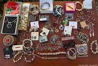Overview of entire jewelry lot spread on table