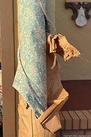 Full roll standing with brown paper wrap showing pattern