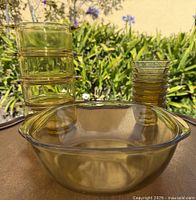 All items grouped: casserole bowl, four square dishes, stack of glasses