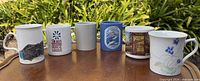 All six mugs lined on table front view