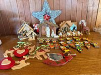 Overview of nativity sets, wooden ornaments, horse figurine