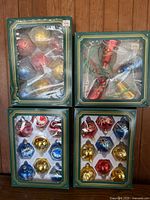 Group shot of four ornament boxes showing assorted colours and styles