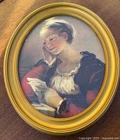 Front view of oval framed print