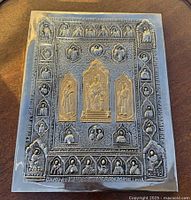 Front view of nickel-plated copper icon cover showing full relief imagery