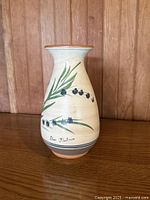 Front view of Lluc Mallorca ceramic vase showing signature and floral design